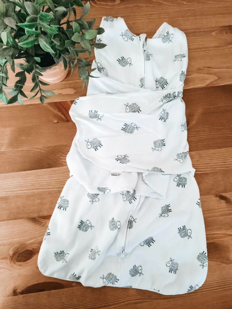White HALO sleepsack swaddle with sheep pattern